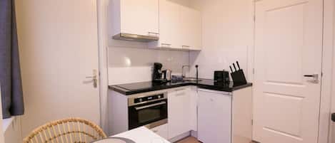 Fridge, coffee/tea maker, cookware/dishes/utensils