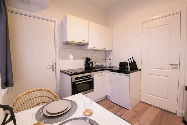Fridge, coffee/tea maker, cookware/dishes/utensils