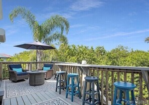 Property grounds - Spacious 3BR, 2BA beach home just a short walk from the sand! Three bedrooms up, private queen room and bath down. Secure 2-car garage for vehicles or a small boat. Perfect for families or groups. 30-day minimum stay required. (New Smyrna Beach)