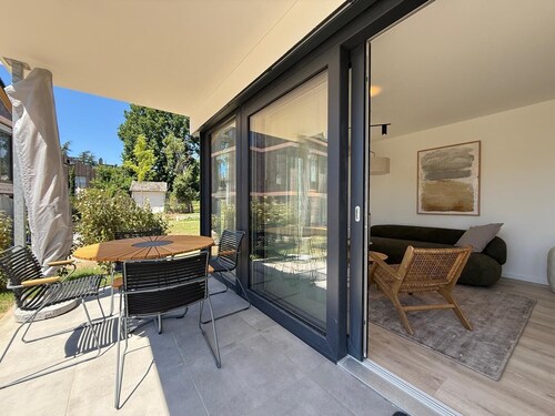 Modern Suite Happiness with covered terrace near the lake and beach in Uhldinge