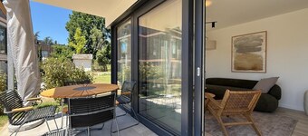 Modern Suite Happiness with covered terrace near the lake and beach in Uhldinge