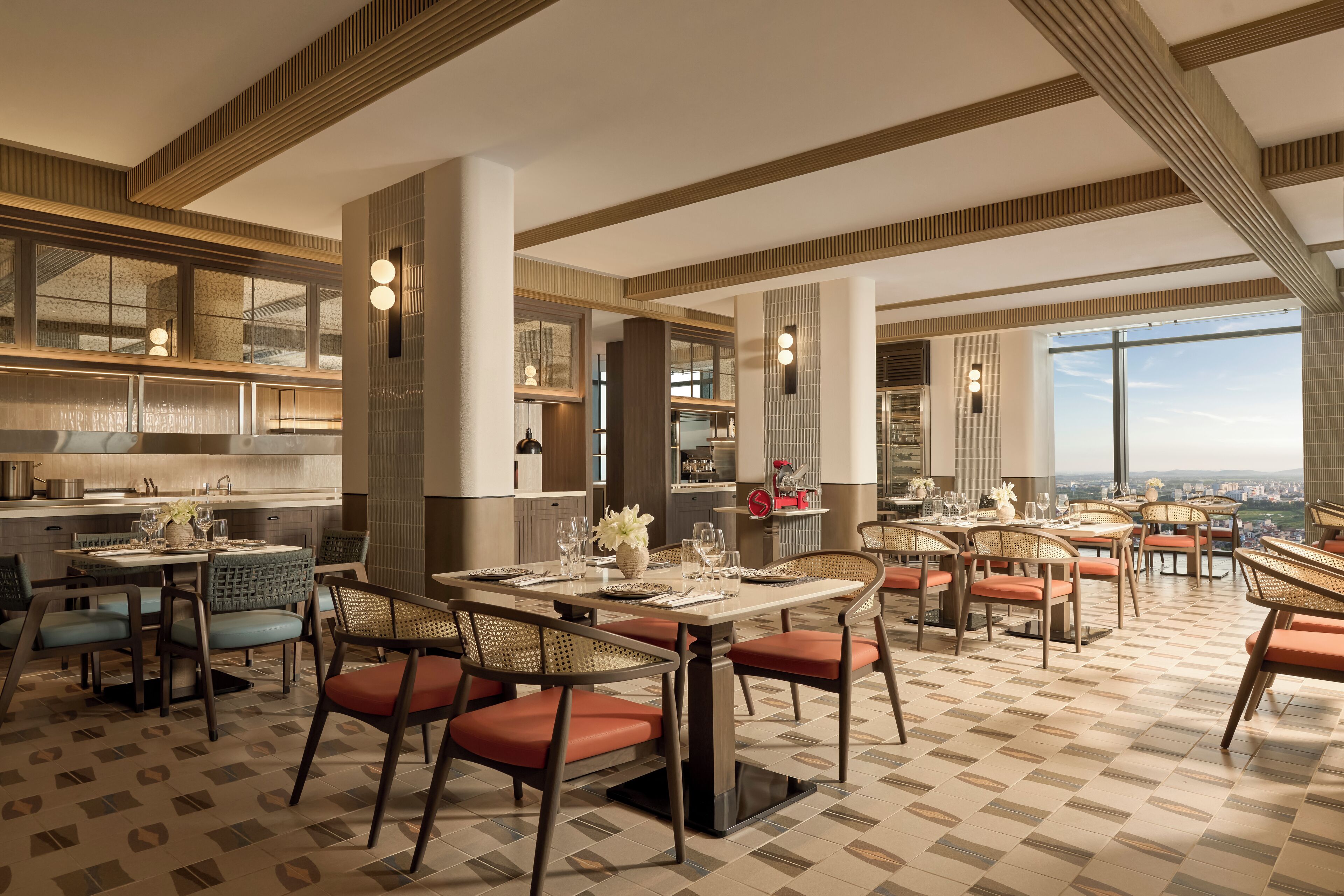 A spacious dining area with high ceilings and large windows offering a city view.