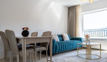 Deluxe Apartment, 1 Bedroom, Balcony, Mountain View | Living area | 125-cm Smart TV with cable channels, Netflix, streaming services