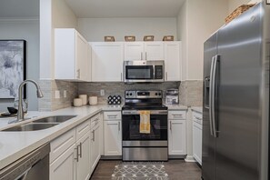 Signature Condo, 2 Bedrooms | Private kitchen | Fridge, microwave, oven, stovetop
