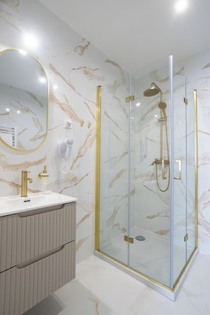 Shower, hair dryer, towels, soap