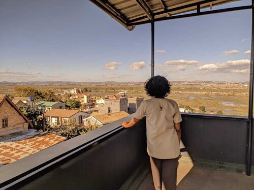 Apartment with views of the city on one side and the countryside on the other.
