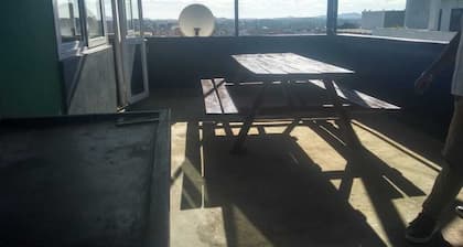 Apartment with views of the city on one side and the countryside on the other.