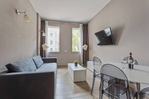 Apartment, 1 Queen Bed with Sofa bed | Living area | 32-inch flat-screen TV with digital channels