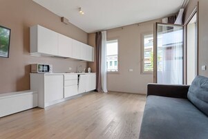 Apartment, 2 Bedrooms, Balcony | Living area | 32-inch flat-screen TV with digital channels