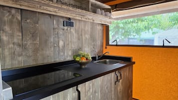 Fridge, coffee/tea maker, toaster, cookware/dishes/utensils