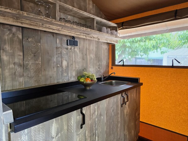 Fridge, coffee/tea maker, toaster, cookware/dishes/utensils