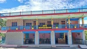 A two-story building with a sign reading "HOTEL MOUNTAIN PARADISE". - Hotel Mountain Paradise Barkot (Barkot)
