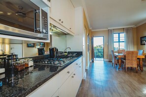 Comfort Apartment, 4 Bedrooms | Private kitchenette | Full-sized fridge, microwave, stovetop, electric kettle