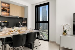 Luxury Apartment, 2 Bedrooms, Balcony, Pool View | Dining room - Delujo Stays – Burj Crown Collection (Dubai)