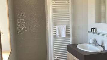 Shower, hair dryer, towels, toilet paper