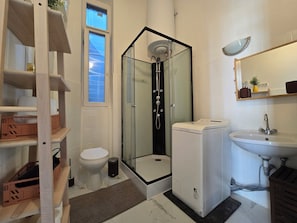 Shower, hair dryer, towels, soap