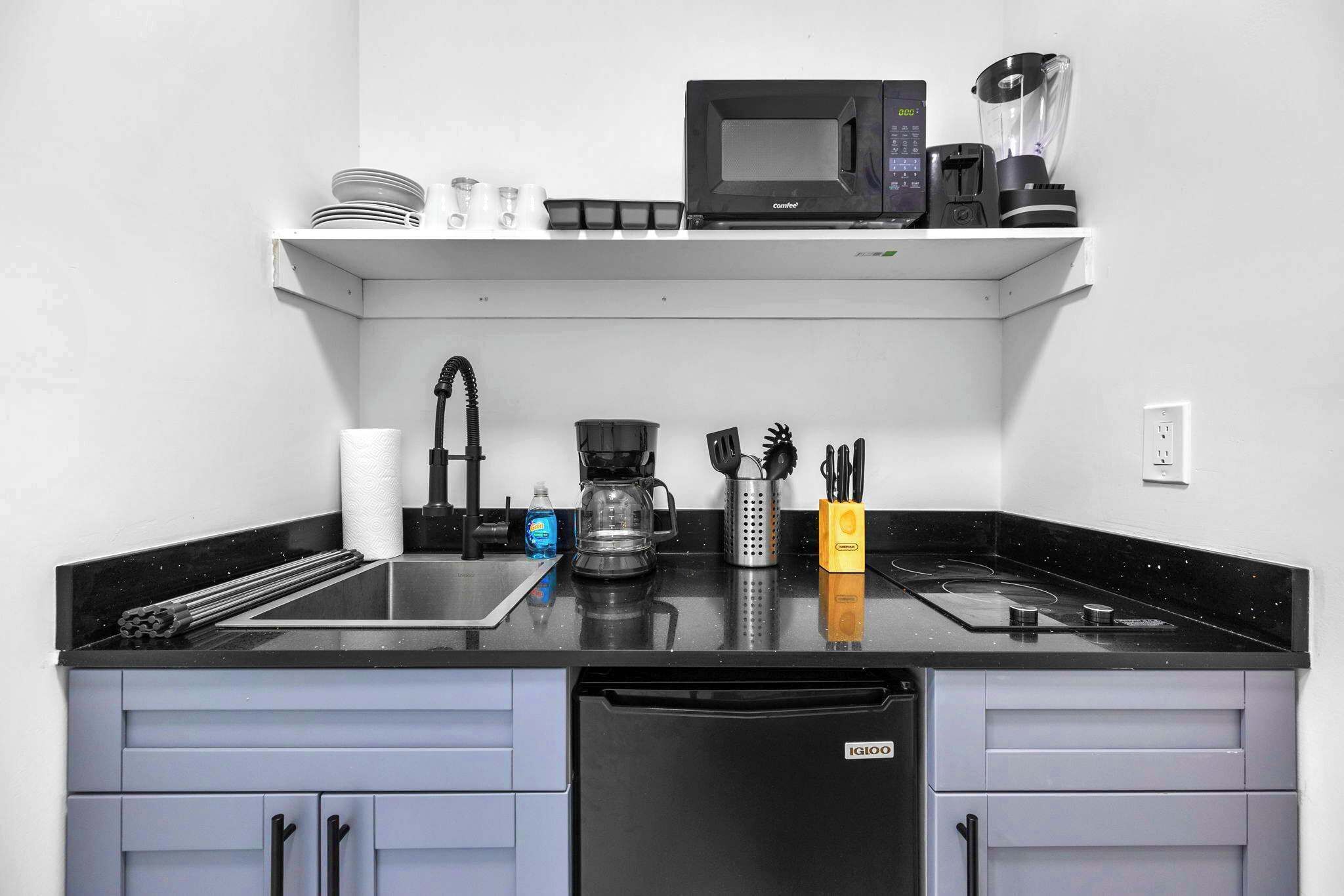 Fridge, microwave, stovetop, coffee/tea maker