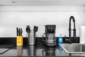 Fridge, microwave, stovetop, coffee/tea maker