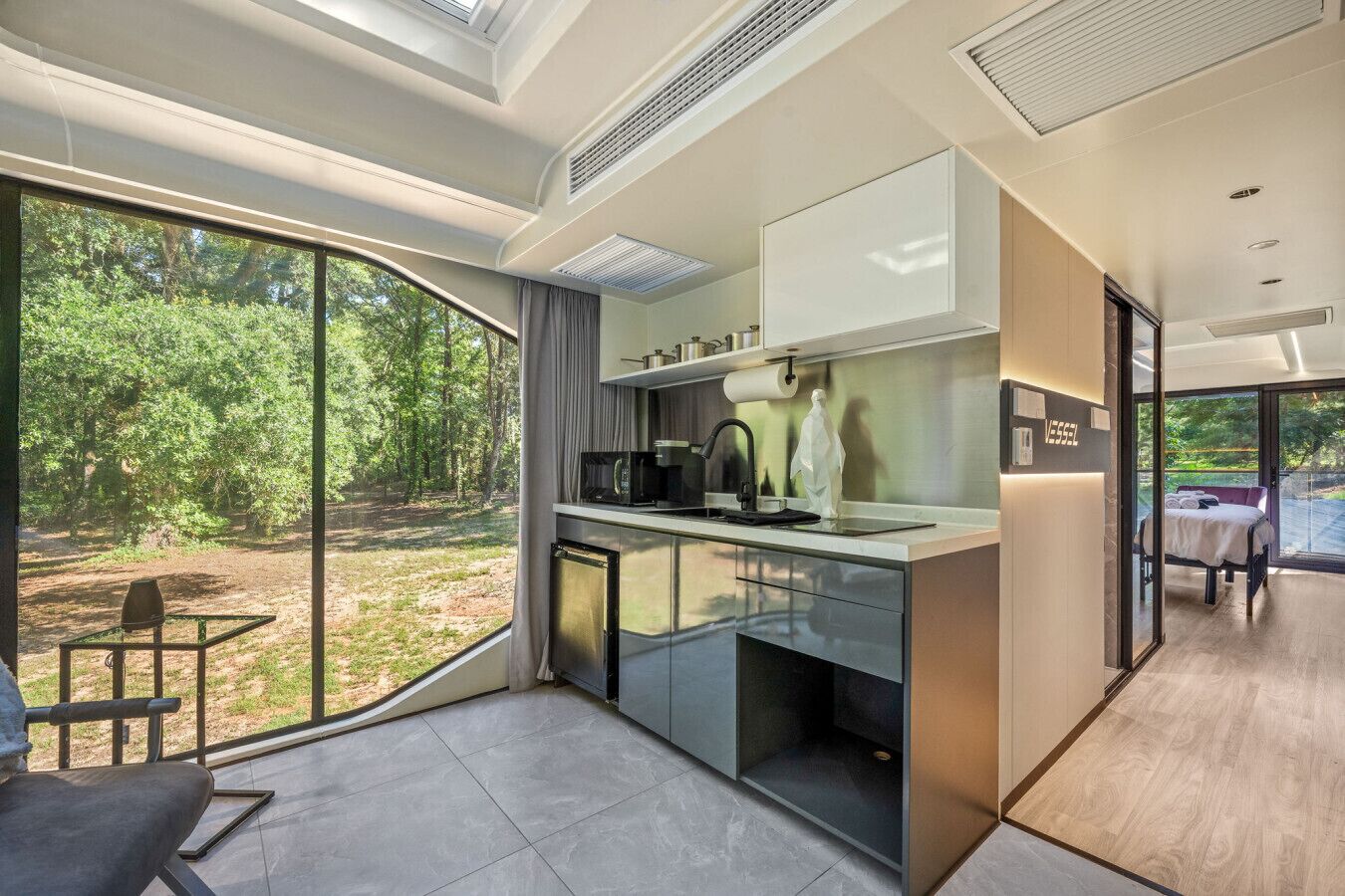 Fridge, microwave, coffee/tea maker, cookware/dishes/utensils