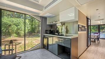 Fridge, microwave, coffee/tea maker, cookware/dishes/utensils