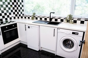 Fridge, microwave, dishwasher, cookware/dishes/utensils