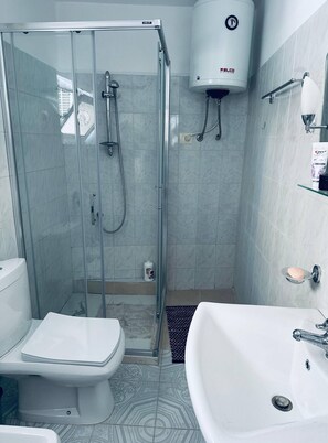 Shower, hair dryer, towels, soap