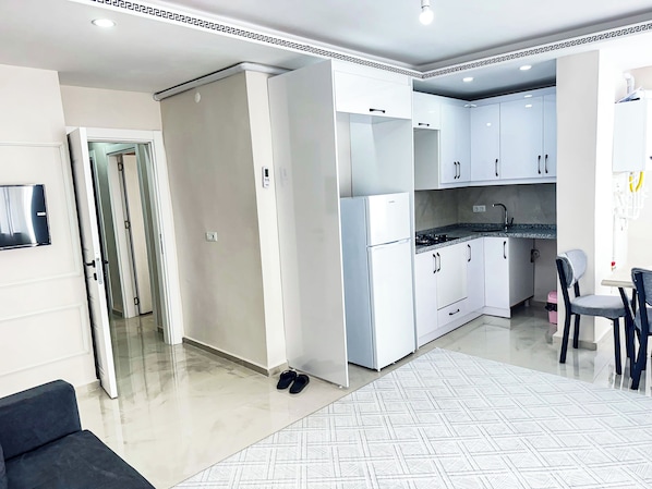 Appartement Deluxe, 1 trÚs grand lit et 1 canapé-lit, balcon | Coin séjour