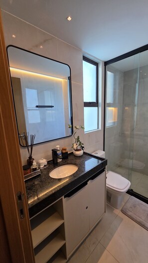Deluxe Apartment, Courtyard View | Bathroom | Shower, towels, soap, toilet paper