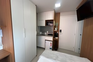 Fridge, microwave, coffee/tea maker, cookware/dishes/utensils