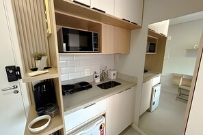 Microwave, coffee/tea maker, cookware/dishes/utensils