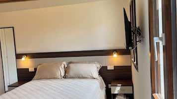 Deluxe Room, Garden View | Desk, laptop workspace, free WiFi, bed sheets