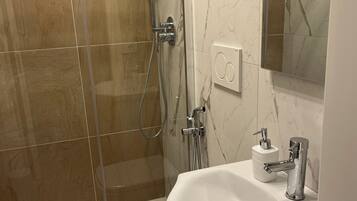 Bathroom | Shower, hair dryer, towels, soap