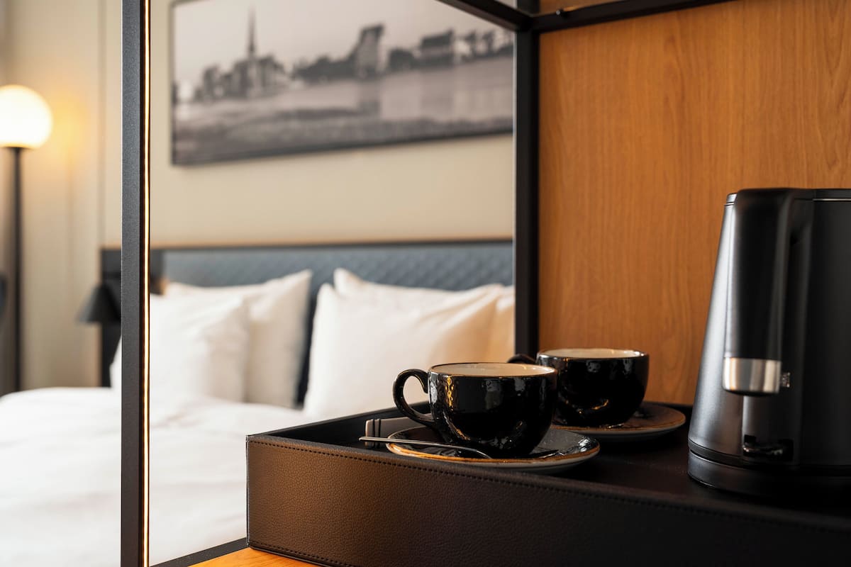 Hypo-allergenic bedding, down comforters, minibar, in-room safe