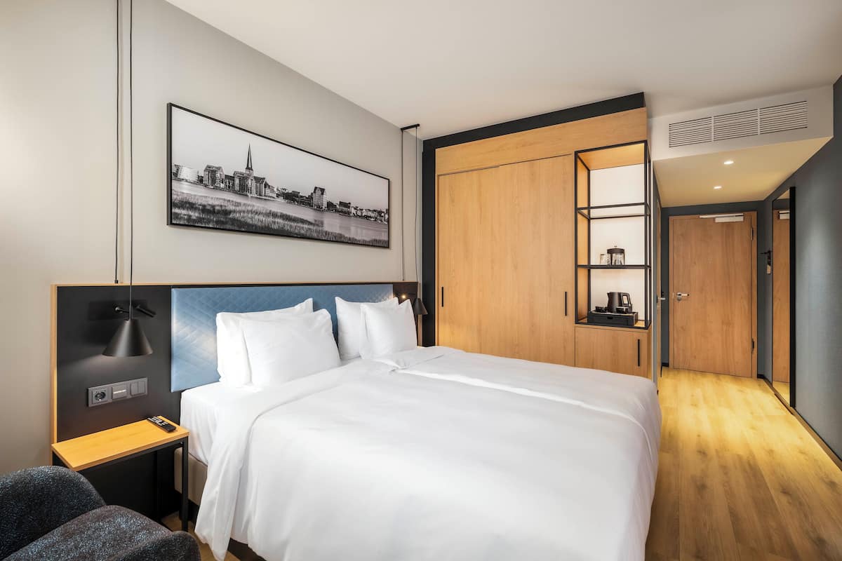 Hypo-allergenic bedding, down comforters, minibar, in-room safe