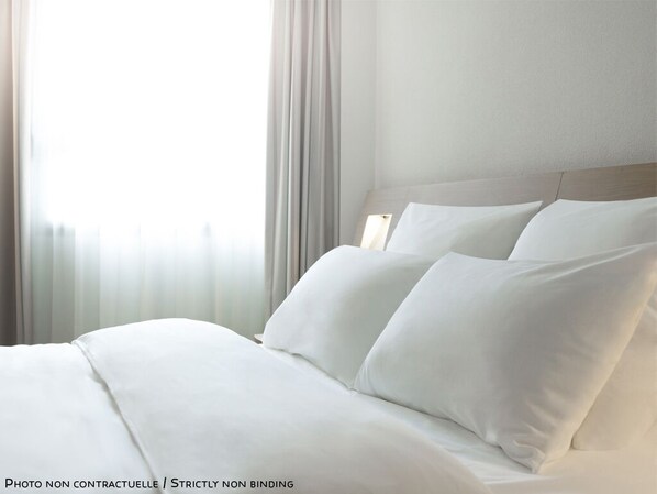 Blackout drapes, soundproofing, iron/ironing board, free WiFi
