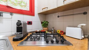 Apartment (1 Bedroom) | Private kitchen | Microwave, espresso maker, electric kettle, highchair