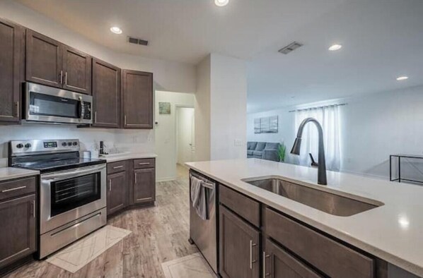 Fridge, microwave, dishwasher, cookware/dishes/utensils