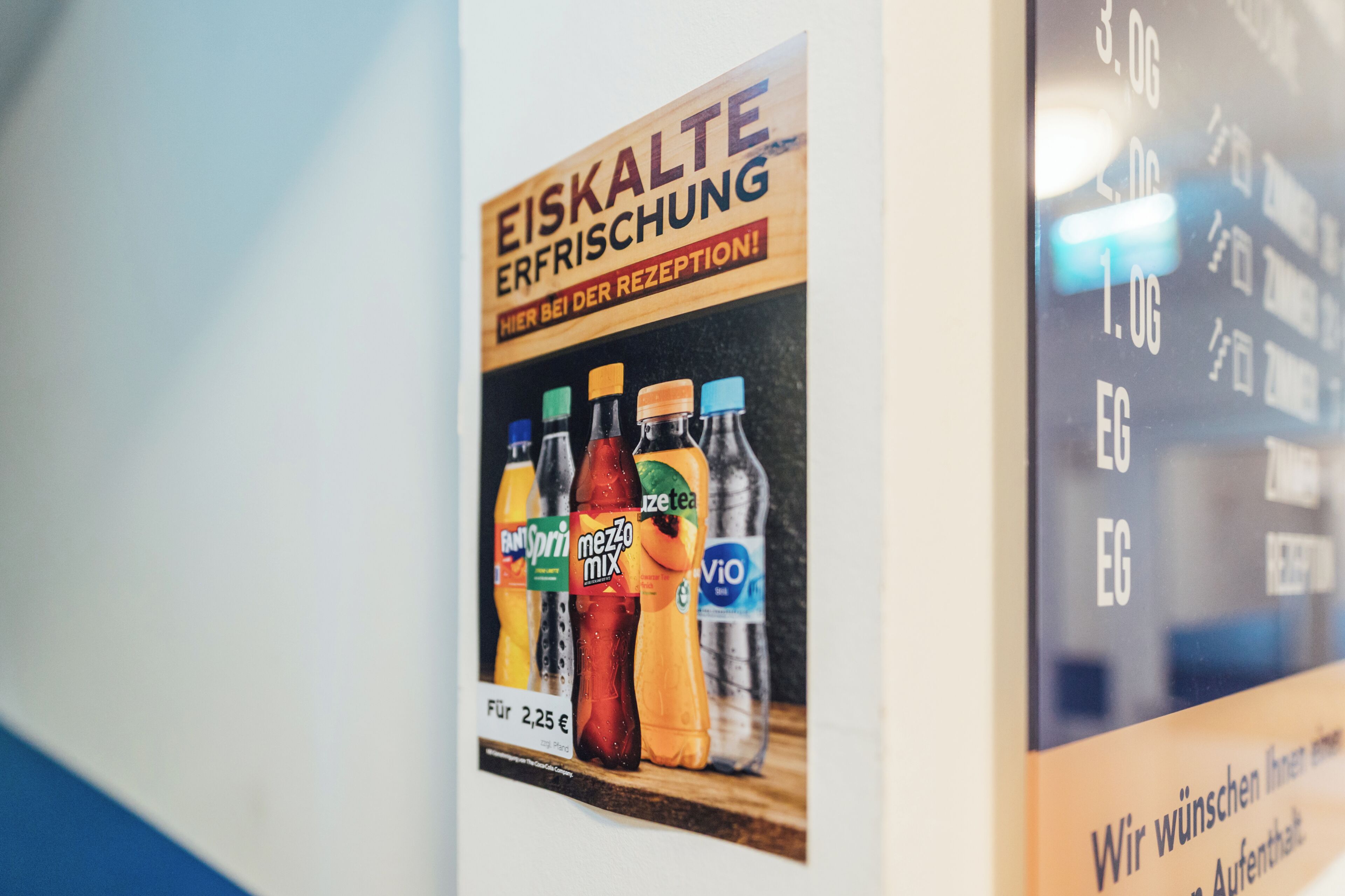 A poster advertising beverages with a price tag of 2.25 euros.