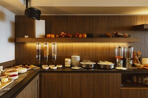 A breakfast buffet setup with various food items and serving utensils. - Hotel & Spa Amoria La Baule, A Member Of Radisson Individuals (La Baule-Escoublac)