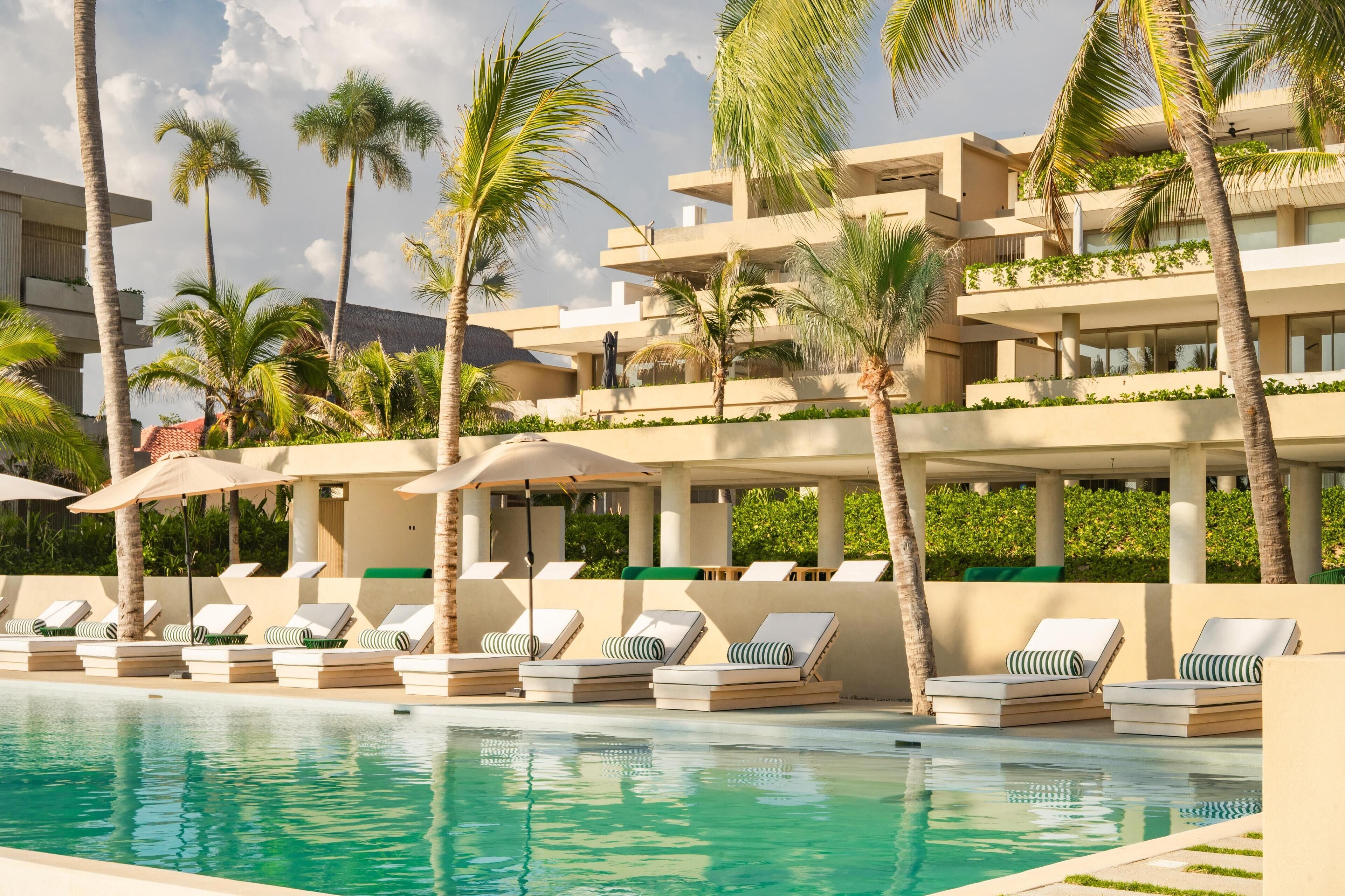 Outdoor pool, open 9:00 AM to 9:00 PM, pool loungers