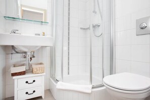 Shower, hair dryer, towels, shampoo