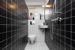 Shower, hair dryer, towels, shampoo