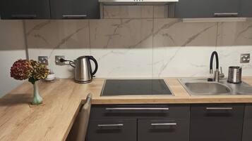 Fridge, microwave, stovetop, cookware/dishes/utensils