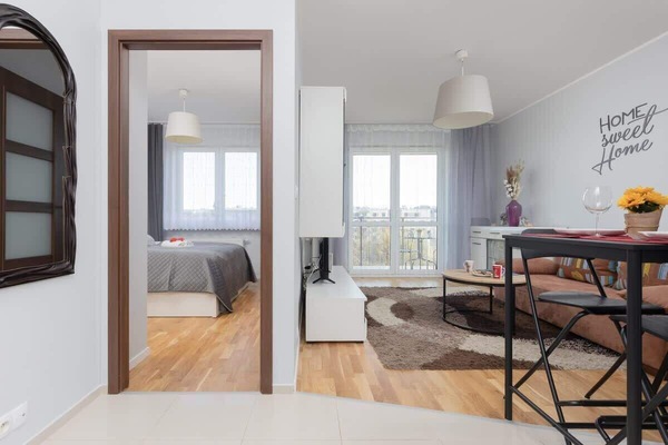 Perspective from hallway showing bedroom and living area layout.
