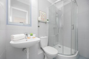 Shower, hair dryer, towels, shampoo