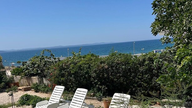 A poolside area with lounge chairs and a view of the ocean. - Spacious seaside villa, Private Pool &Parking,5 bedrooms,Sea View,Diklo,Zadar (Zadar)