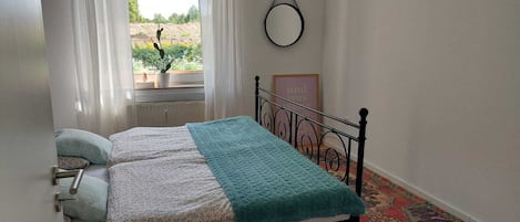 1 bedroom, desk, iron/ironing board, travel crib