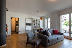 Deluxe Duplex, City View | Living area | 43-inch Smart TV with digital channels