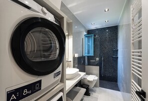 Shower, hair dryer, towels, soap
