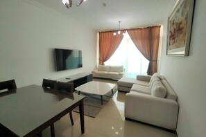 Living area - Charming 2-bedroom apartment with WiFi, AC in serene Ajman (Ajman)